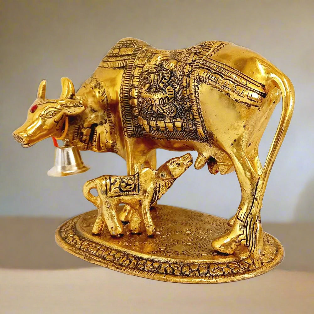 Metal idol of Kamdhenu cow with calf, Lakshmi ji, and Ganesh ji, perfect for pooja room decoration