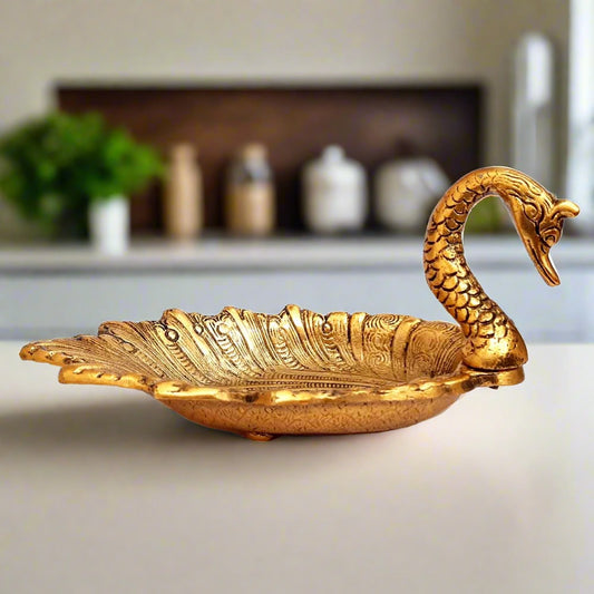 Pure metal dry fruit platter shaped like a duck, decorated with beautiful golden oxidize polish.