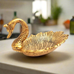 Metal duck platter featuring golden oxidize polish, designed as a stylish dry fruit serving tray.