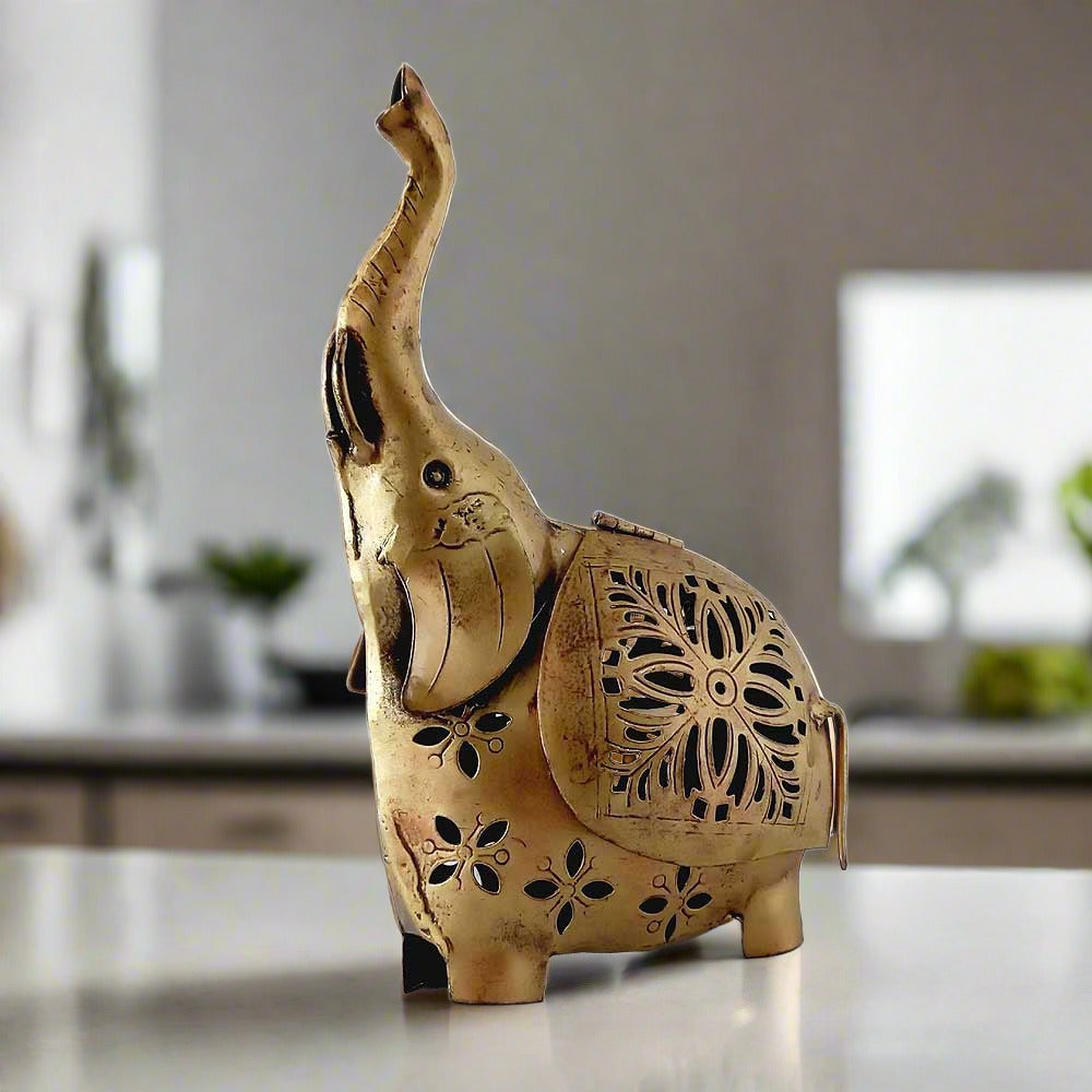 A metal elephant showpiece with a net-design body that creates an amazing shade when a candle is lit.