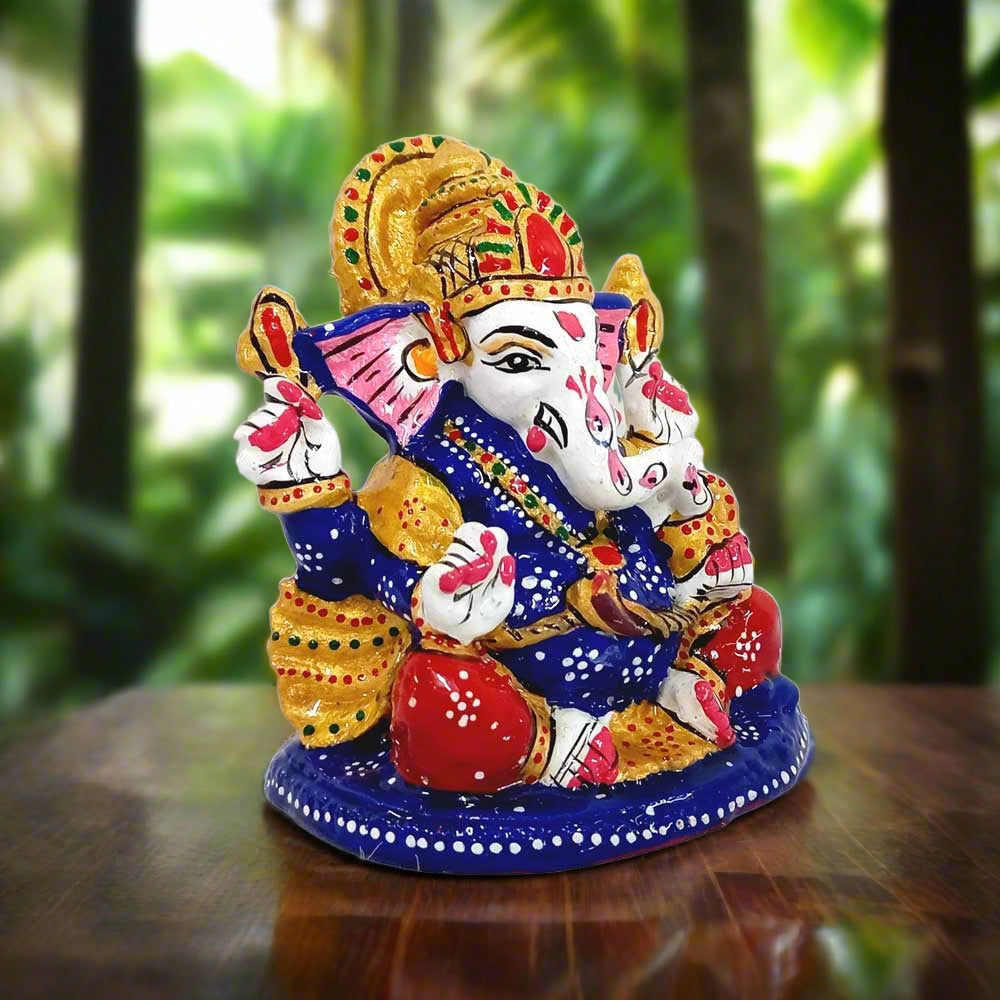 Metal Ganesha idol decorated with colorful meenakari painting, perfect for car dashboard and spiritual decor