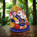 Metal Ganesha idol decorated with colorful meenakari painting, perfect for car dashboard and spiritual decor
