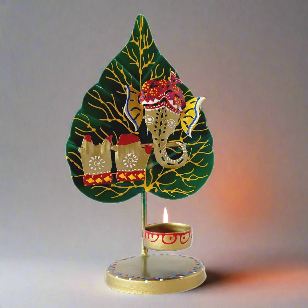 A metal Ganesha figurine playing a flute, perfect for home decor and gifting.
