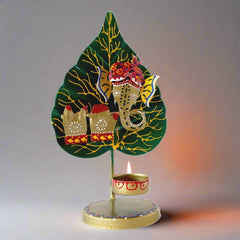 A metal Ganesha figurine playing a flute, perfect for home decor and gifting.