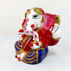 Metal Ganesha idol adorned with intricate meenakari painting, perfect for gifting and spiritual decoration