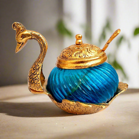 Attractive metal and glass bowl set with duck design, includes a matching spoon, perfect for table or dining table decor.