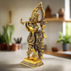 A metal Krishna Ji showpiece, perfect for home, office, or pooja room decor.