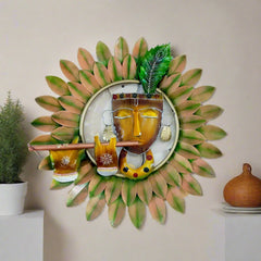 A beautiful metal wall hanging frame of Krishna playing the flute, with a lovely leaf design and hand painting.