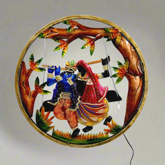 Metal Radha Krishna wall decor frame with LED light and colorful hand painting, creating a spectacular night display.
