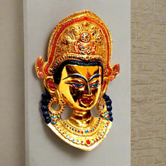 Tibetan Buddha statue made of fine quality metal with long-lasting golden polish and detailed hand painting.