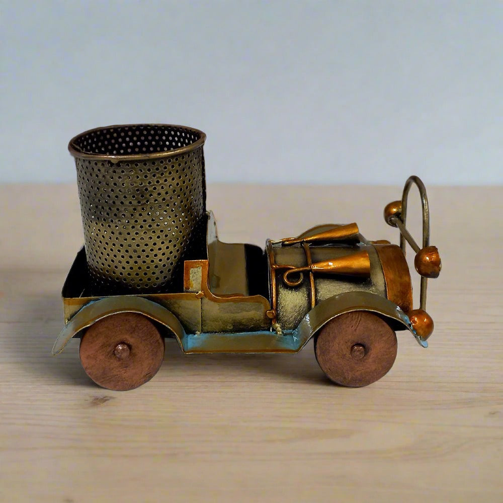 Handcrafted metal vintage car pen holder with intricate antique painting, perfect for gifting office staff and friends.

