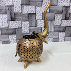 Modern golden metal elephant candle holder with mesh pattern, a unique piece for festive and daily decoration.