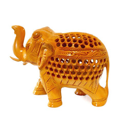 A beautifully ornate undercut elephant with a baby elephant visible inside the carving.