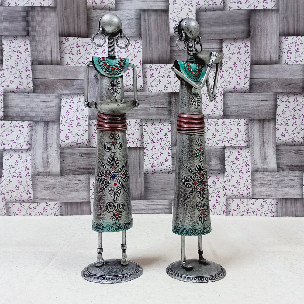 Oxidized metal tribal lady candle holders with intricate emboss design and bowls for candles, a stunning decorative piece.
