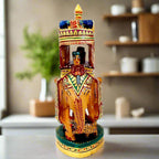 Painted wooden elephant showpiece with a king (maharaja) riding on a pavilion.
