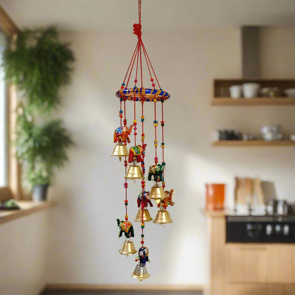 A beautiful handmade elephant toran made of papermache, adorned with colorful colors and golden bells.