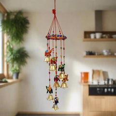 A beautiful handmade elephant toran made of papermache, adorned with colorful colors and golden bells.