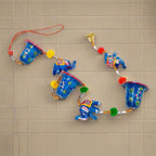 A beautiful papermache toran set of two, with a blue color combination, elephants, and bells.