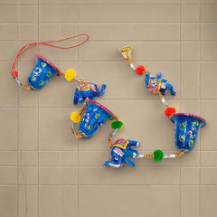 A beautiful papermache toran set of two, with a blue color combination, elephants, and bells.