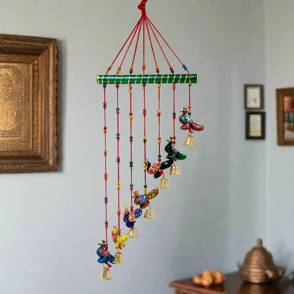 Hand-painted paper mache peacock toran with slant design for wall or door decoration.