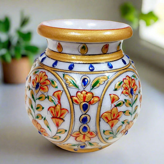 A beautiful pure marble pot decorated with emboss painting and studded with blue stones.