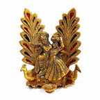 Golden Radha Krishna diya statue lit aarti home temple ambiance