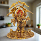 Intricately detailed metal Radha Krishna idol with elegant tree and peacock design