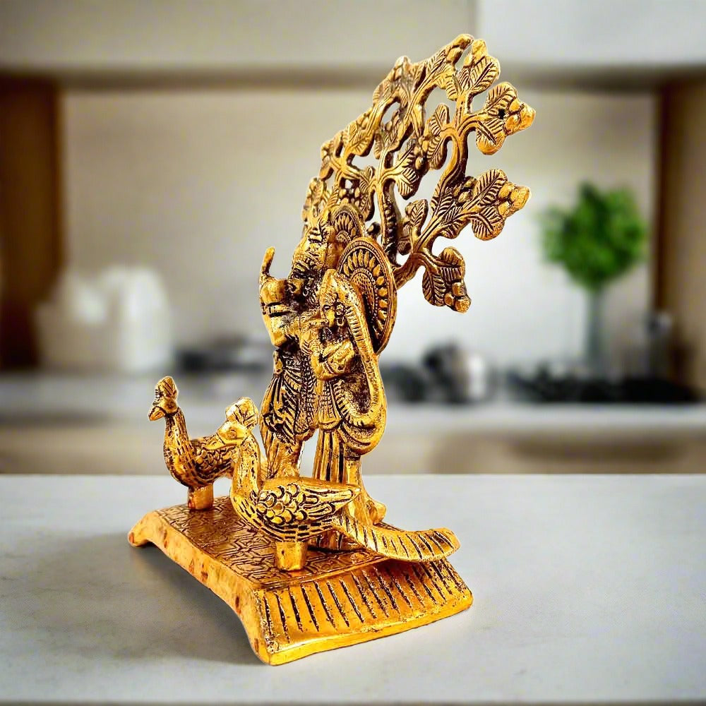 Handcrafted metal Radha Krishna idol with two peacocks – symbolizes love, devotion & harmony.