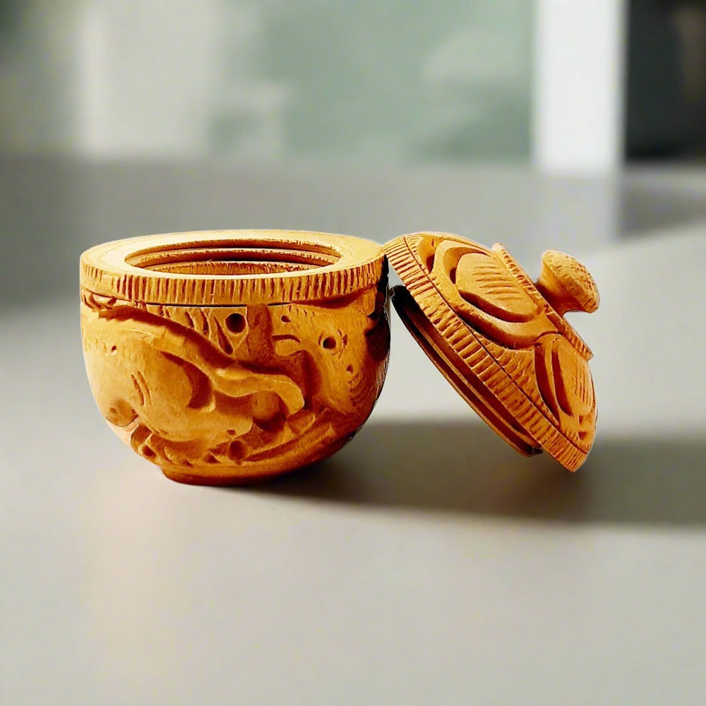 Round wooden kumkum box featuring bangle cut threading on the box and lid, decorated with exquisite hand craftsmanship.

