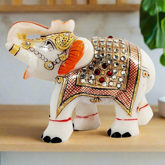 Handcrafted pure marble salami elephant statue with kundan stones front view.