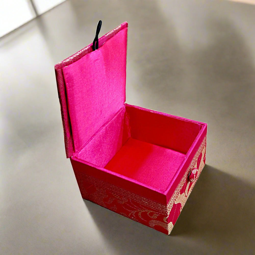 Silk fabric box decorated with intricate zardosi handwork, designed for storing earrings, jhumkas, chains, and pins.