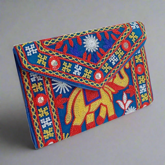 Silk clutch purse with intricate embroidery, zip compartment, and handle, perfect for girls and women.