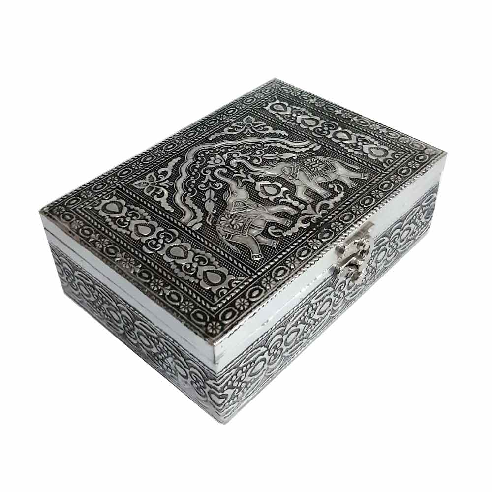 Close-up lid detail of wood and metal jewelry box with stunning elephant motif