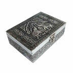 Close-up lid detail of wood and metal jewelry box with stunning elephant motif