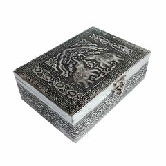 Close-up lid detail of wood and metal jewelry box with stunning elephant motif