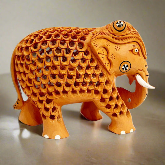Single wood carved elephant figurine with inlay work and mesh design on stomach, perfect for decorative purposes
