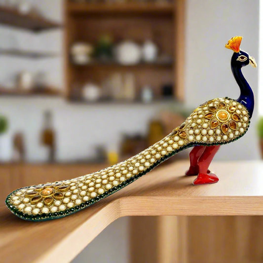 Solid metal peacock figurine with enamel painting and decorative stones, pearls, and attractive feather design