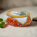 White marble coaster set featuring detailed peacock artwork and emboss-painted holder, ideal for dining or office tables.