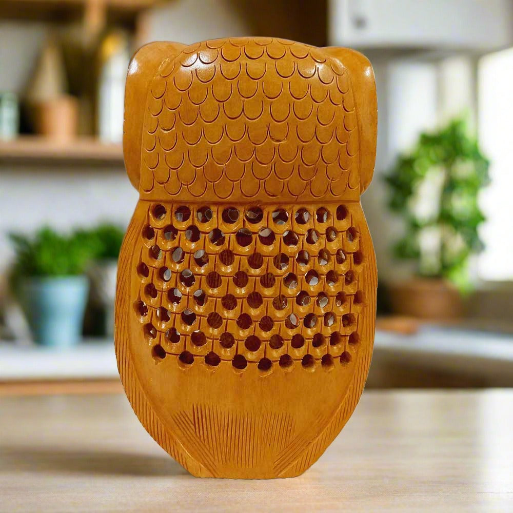 A spectacular wooden owl showpiece carved from a single piece of wood.