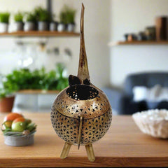 Stylish elephant-shaped metal candle stand with golden mesh design, adding charm and warmth to any space.