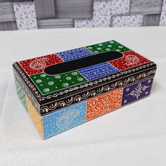 Traditional handmade wooden tissue holder adorned with colorful artwork, functional and decorative.

