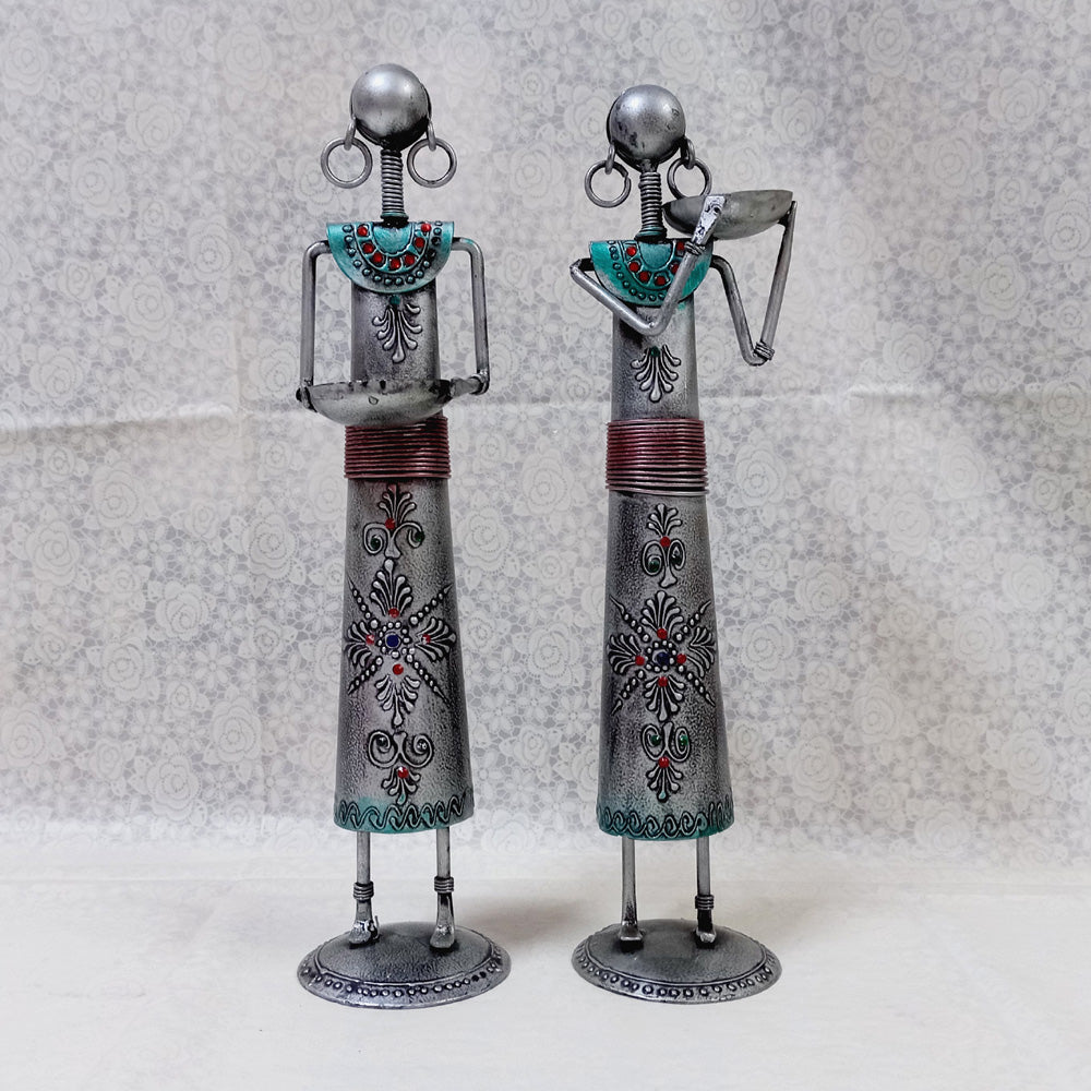 Traditional metal tribal candle holder set decorated with emboss painting and silver oxidized color, enhancing cultural home aesthetics.