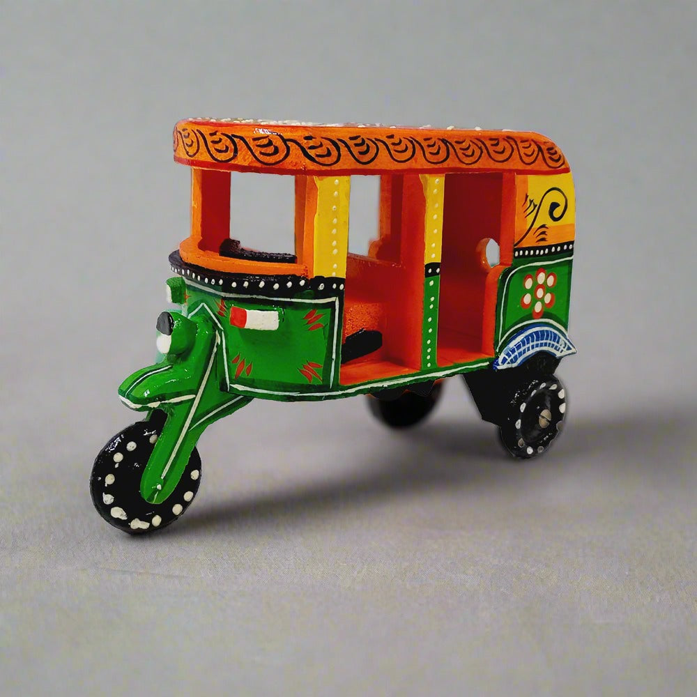 Traditional wooden auto rickshaw showpiece with colorful hand-crafted art, a unique antique gift item.