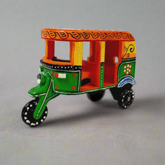 Traditional wooden auto rickshaw showpiece with colorful hand-crafted art, a unique antique gift item.
