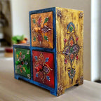 Close-up top detail of hand-painted wooden paint box with commendable color combinations