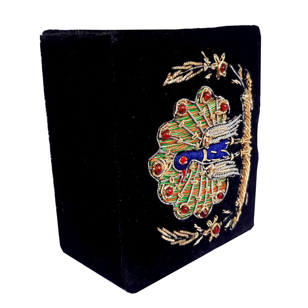 Velvet jewelry box featuring handcrafted zardosi work of peacock motif in silver and gold wires, ideal for gifting.