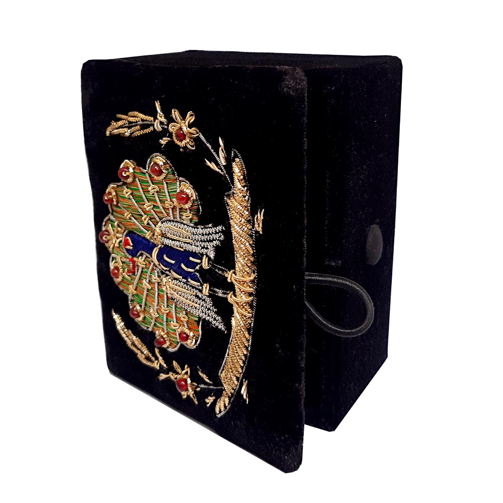 Zardosi jewelry box made of black velvet with intricate silver and golden peacock embroidery, perfect for small jewelry.