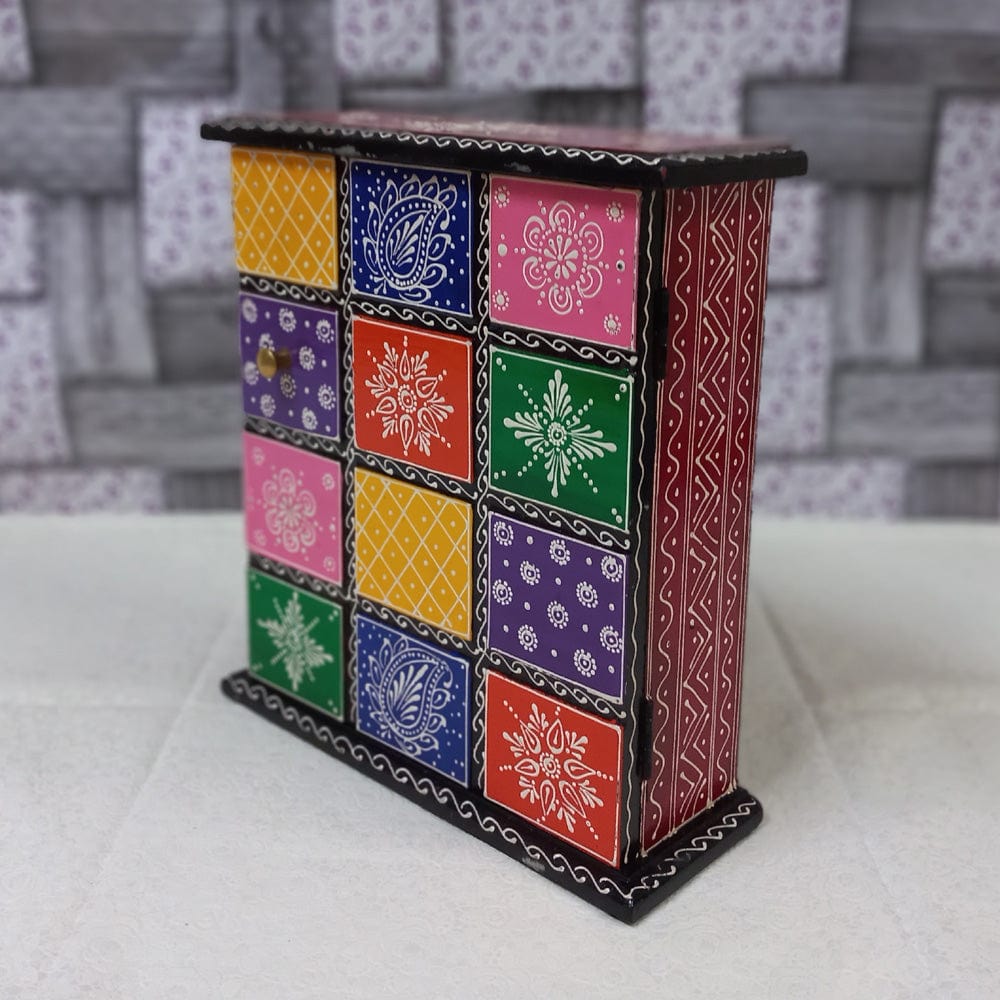 Vibrant wooden key box adorned with detailed hand-painted artwork, a useful and decorative wall accessory.