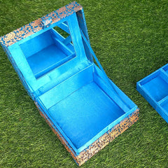 Wedding gift makeup box adorned with exquisite hand-embroidered zardosi work on silk fabric.