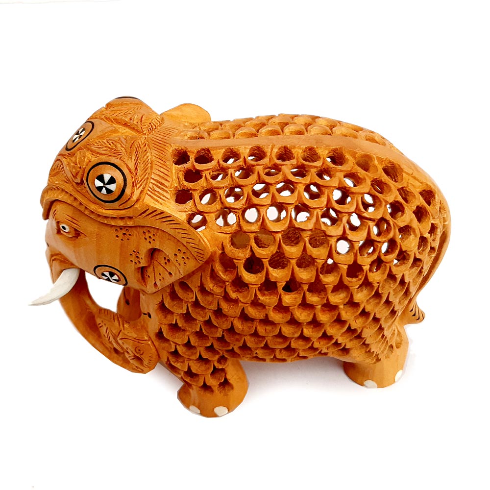 Wood carved elephant idol with detailed mesh and lattice design, made for home decor and gifting